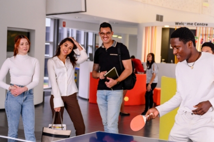 Group playing table tennis